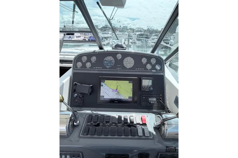 Slide: The Image of Cockpit view of 2001 Tiara Yachts 3500 Open with navigation instruments and controls. - 5