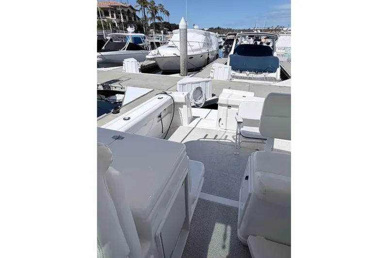Slide: The Image of 2001 Tiara Yachts 3500 Open at dock, luxurious boating experience. - 6