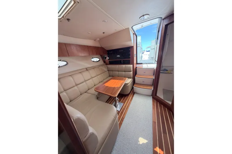 Slide: The Image of Interior of 2001 Tiara Yachts 3500 Open with leather seating. - 9