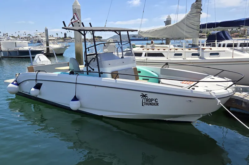 The Image of 2023 Beneteau Flyer 8 SPACEdeck boat docked in marina, labeled "Tropic Thunder." - 0