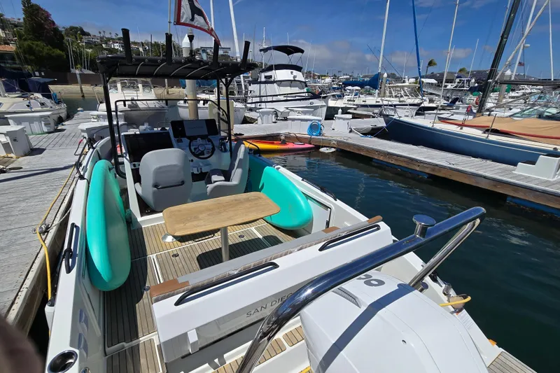 Slide: The Image of 2023 Beneteau Flyer 8 SPACEdeck docked at marina, featuring spacious deck and modern design. - 11