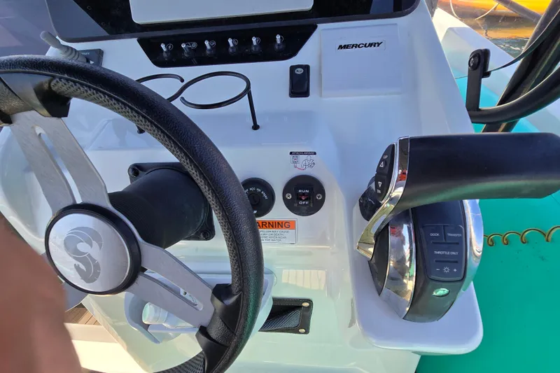 Slide: The Image of Steering console of 2023 Beneteau Flyer 8 SPACEdeck with Mercury controls and throttle. - 13