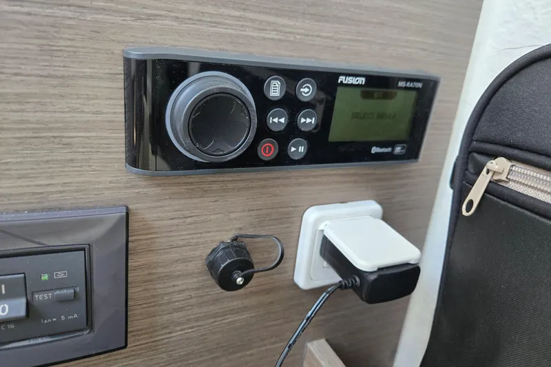 Slide: The Image of Control panel and charging port on 2023 Beneteau Flyer 8 SPACEdeck boat interior. - 23
