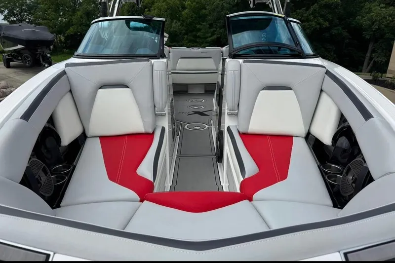 Slide: The Image of 2020 MasterCraft XStar boat interior with red and white seating, sleek design. - 12