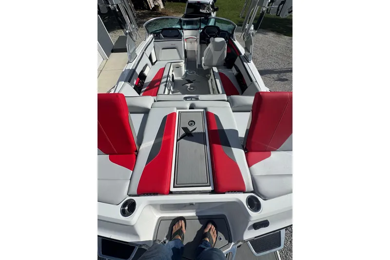 Slide: The Image of 2020 MasterCraft XStar boat interior with red and gray seating. - 15