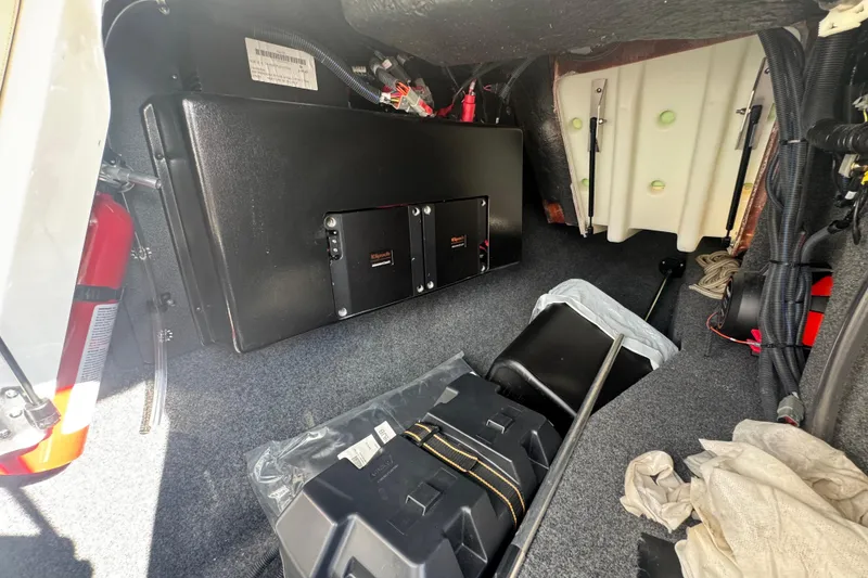 Slide: The Image of 2020 MasterCraft XStar interior storage compartment with equipment and fire extinguisher. - 17