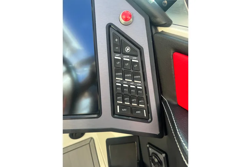 Slide: The Image of Control panel of 2020 MasterCraft XStar boat with various buttons and display. - 19