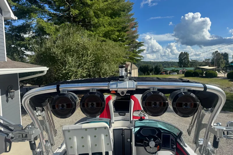 Slide: The Image of 2020 MasterCraft XStar boat with speakers and steering wheel, set against a scenic backdrop. - 22