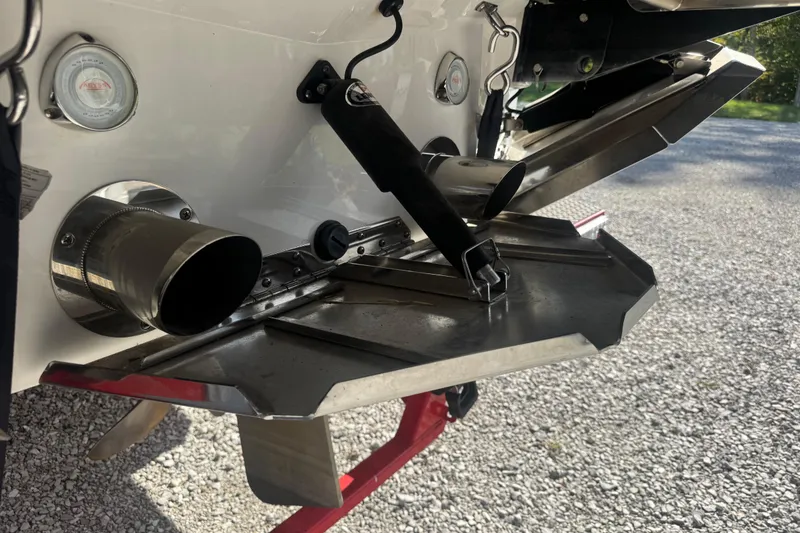 Slide: The Image of Rear view of a 2020 MasterCraft XStar boat with exhaust and trim tabs. - 25