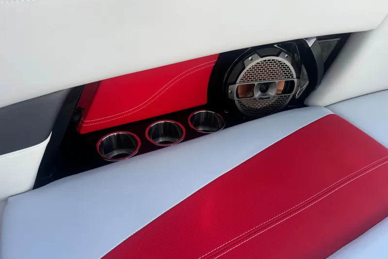 Slide: The Image of Interior of 2020 MasterCraft XStar boat with red and white seating, speaker, and cup holders. - 29