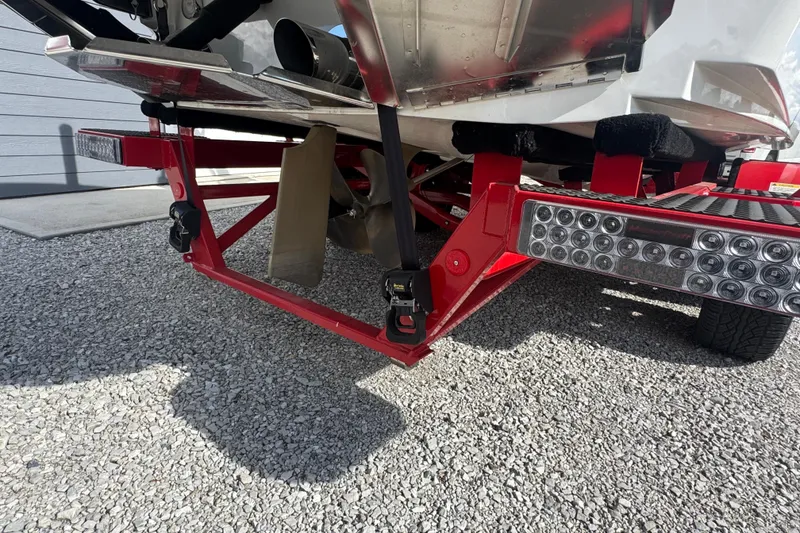 Slide: The Image of Rear view of a 2020 MasterCraft XStar boat on a red trailer. - 37