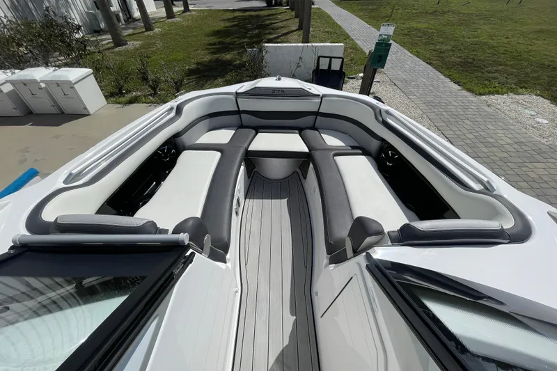 Slide: The Image of 2021 Yamaha Boats 275SE interior with spacious seating and sleek design. - 12