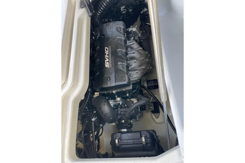 Slide: The Image of 2021 Yamaha Boats 275SE engine compartment showcasing the powerful SVHO engine. - 16