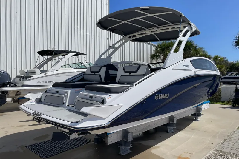 Slide: The Image of 2021 Yamaha Boats 275SE on display, featuring sleek design and modern amenities. - 2