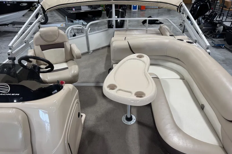 Slide: The Image of Interior of a 2016 Sun Tracker Party Barge 22 XP3 with seating and table. - 10