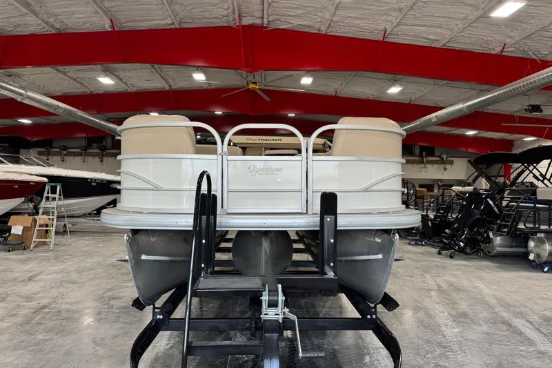 Slide: The Image of 2016 Sun Tracker Party Barge 22 XP3 pontoon boat in a showroom. - 6