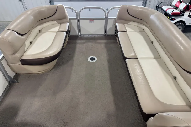 Slide: The Image of 2016 Sun Tracker Party Barge 22 XP3 interior with beige seating and spacious layout. - 8