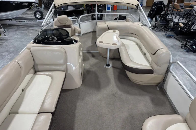 Slide: The Image of 2016 Sun Tracker Party Barge 22 XP3 interior with beige seating and table. - 9