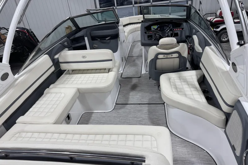 Slide: The Image of 2019 Cobalt R5 boat interior with luxurious white seating and modern dashboard. - 10