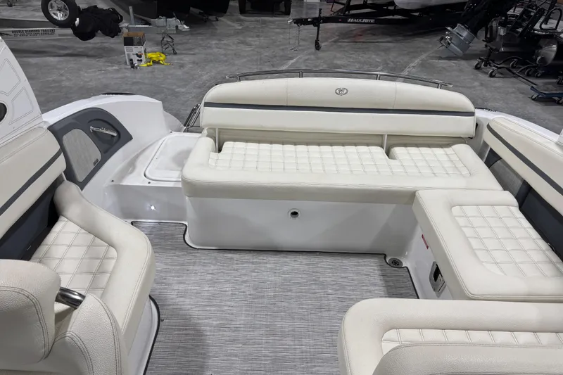 Slide: The Image of 2019 Cobalt R5 boat interior with white cushioned seating and modern design. - 7