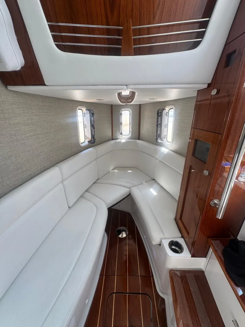Slide: The Image of Interior of 2024 HCB 42 Lujo with luxurious white seating. - 23