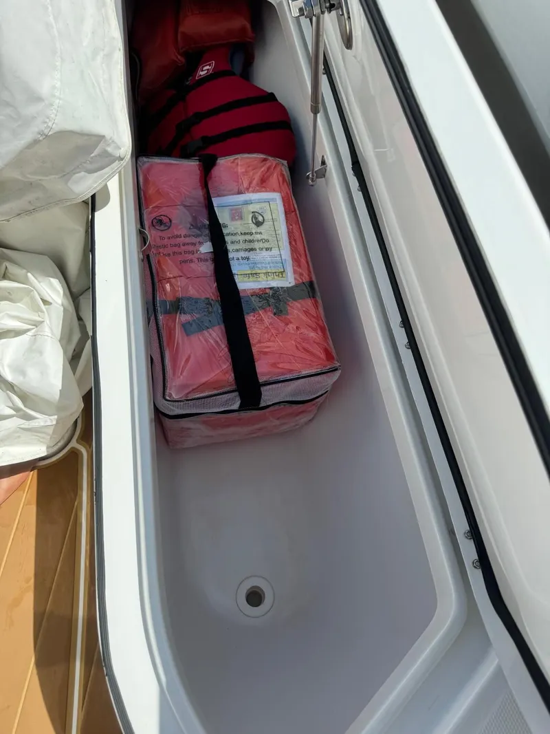 Slide: The Image of Storage compartment in HCB 42 Lujo boat with safety gear, 2024 model. - 26