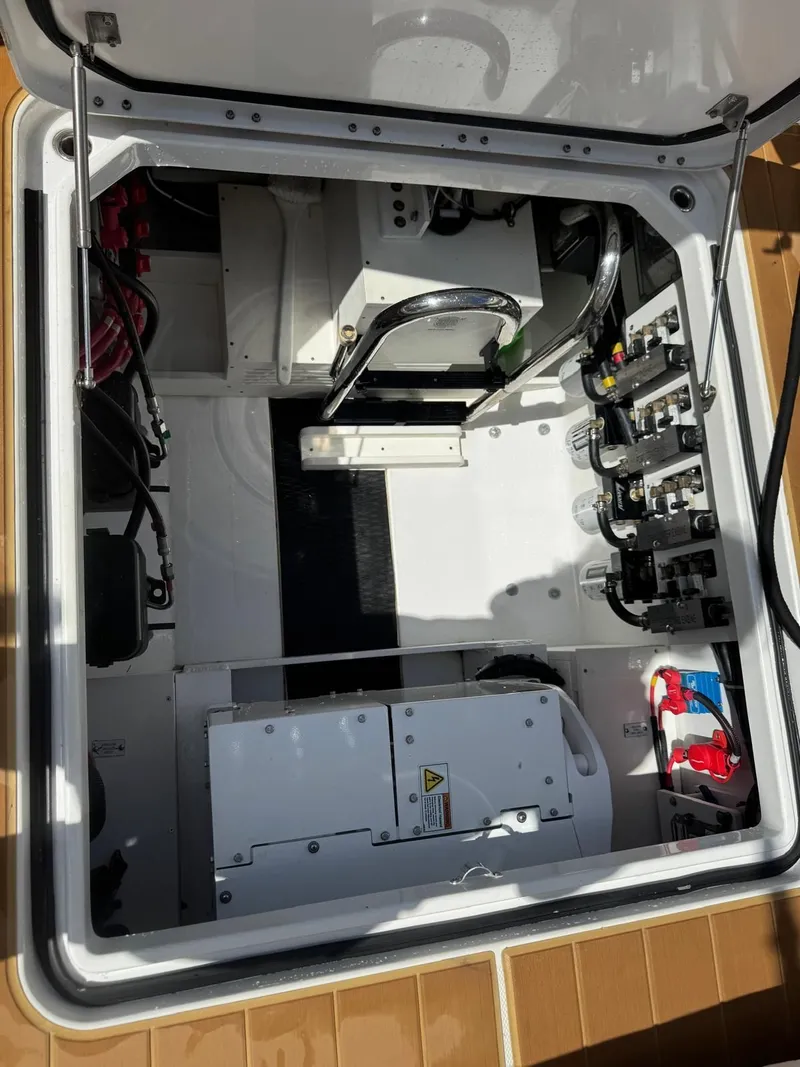 Slide: The Image of Interior view of a 2024 HCB 42 Lujo boat engine compartment. - 27