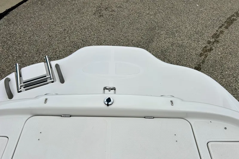 Slide: The Image of 2004 Tahoe Q4 boat deck with ladder on textured surface. - 36
