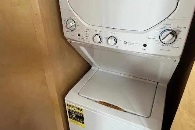 Slide: The Image of Stacked washer and dryer unit inside a 2003 Fantasy 18x80 Houseboat. - 14