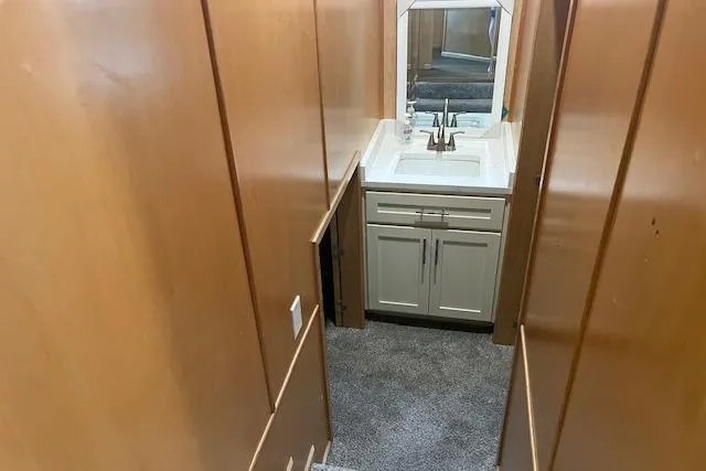 Slide: The Image of Narrow hallway in 2003 Fantasy 18x80 Houseboat with sink and mirror. - 19