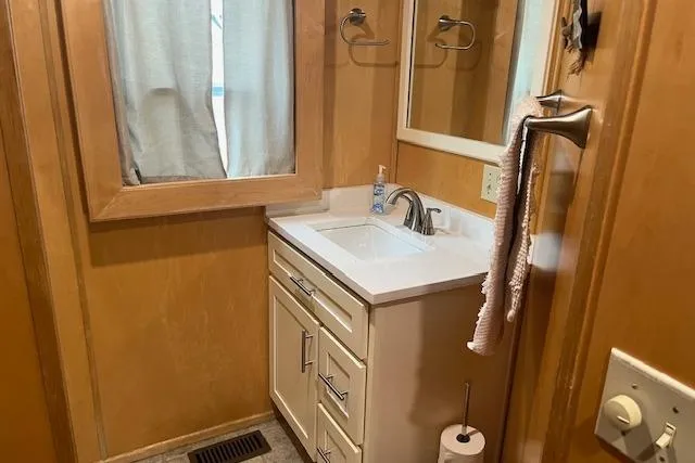 Slide: The Image of Small bathroom in a 2003 Fantasy 18x80 houseboat with sink and mirror. - 20