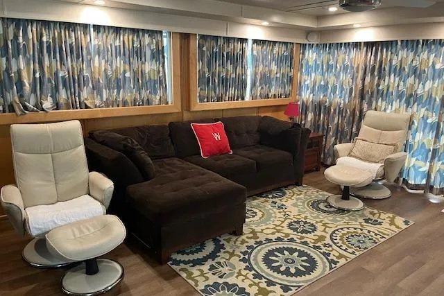 Slide: The Image of Luxurious 2003 Fantasy 18x80 houseboat interior with cozy seating and vibrant decor. - 8