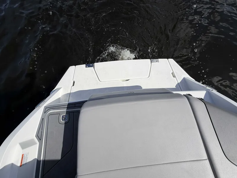 Slide: The Image of 2025 Cobalt CS23 Surf boat on a calm lake. - 10