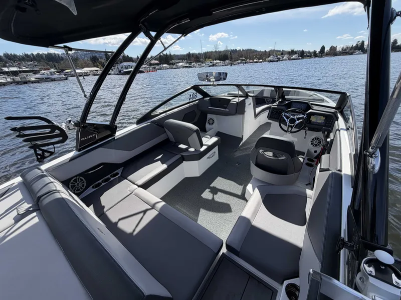 Slide: The Image of 2025 Cobalt CS23 Surf boat on calm lake. - 12