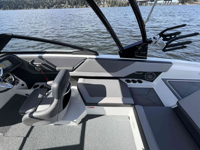 Slide: The Image of Interior of 2025 Cobalt CS23 Surf boat on a lake. - 13