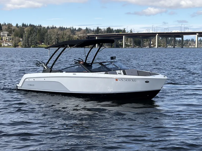 Slide: The Image of 2025 Cobalt CS23 Surf boat on a calm lake. - 4