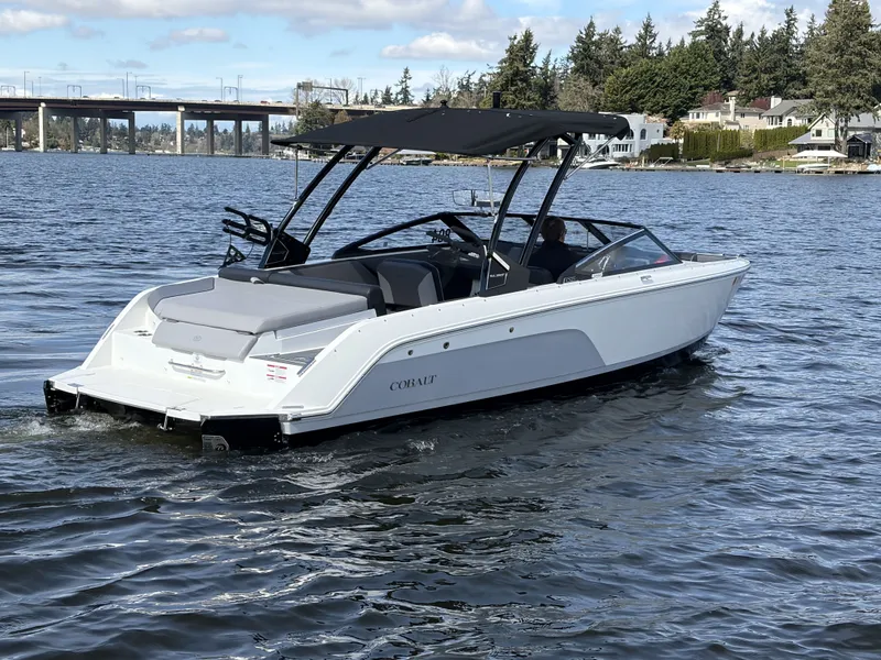 Slide: The Image of 2025 Cobalt CS23 Surf boat on a calm lake. - 6