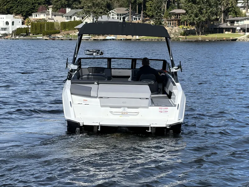 Slide: The Image of 2025 Cobalt CS23 Surf boat on a calm lake. - 7