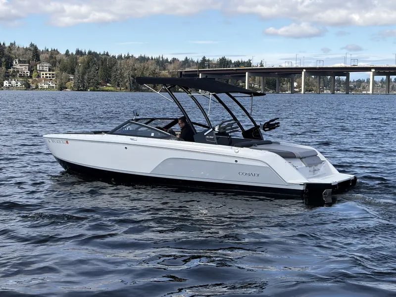 Slide: The Image of 2025 Cobalt CS23 Surf boat on a calm lake. - 8