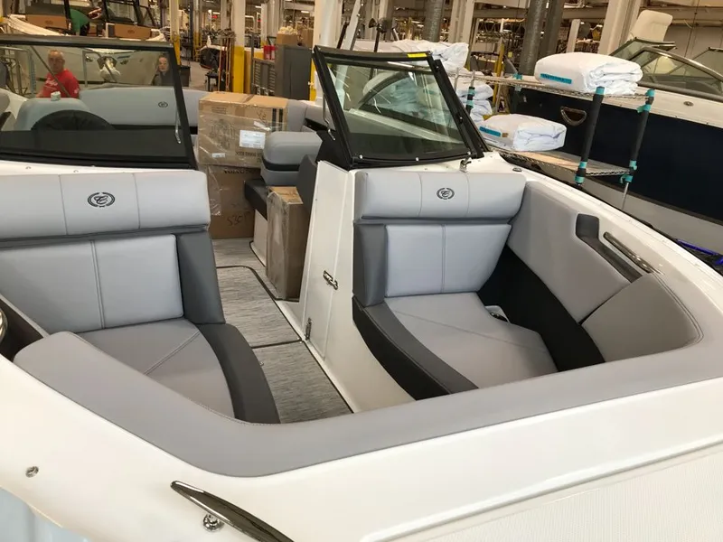 Slide: The Image of Interior of 2023 Cobalt CS23 Surf boat with gray upholstery. - 3