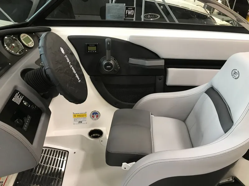 Slide: The Image of Interior of 2023 Cobalt CS23 Surf boat with steering and seat. - 5