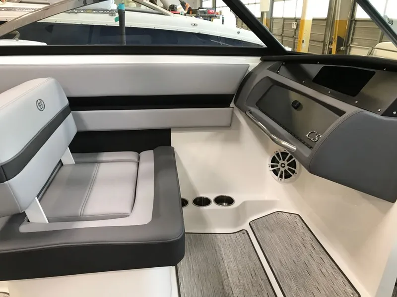 Slide: The Image of Interior of 2023 Cobalt CS23 Surf boat with gray seating. - 6
