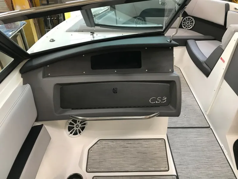 Slide: The Image of Interior of 2023 Cobalt CS23 Surf boat, gray upholstery and speakers. - 7