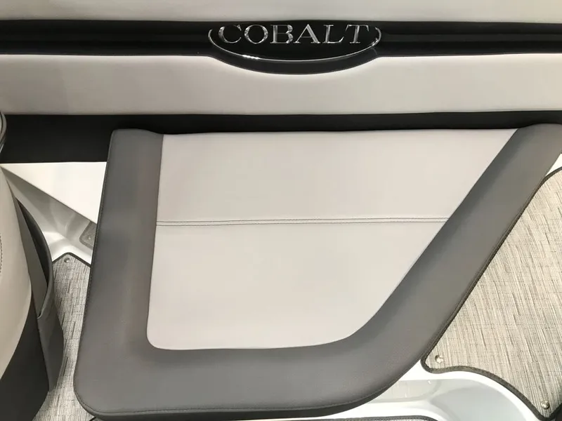 Slide: The Image of Interior of 2023 Cobalt CS23 Surf boat, gray upholstery. - 9