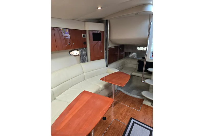 Slide: The Image of Luxurious interior of 2007 Formula 34 Performance Cruiser with leather seating and wooden tables. - 10