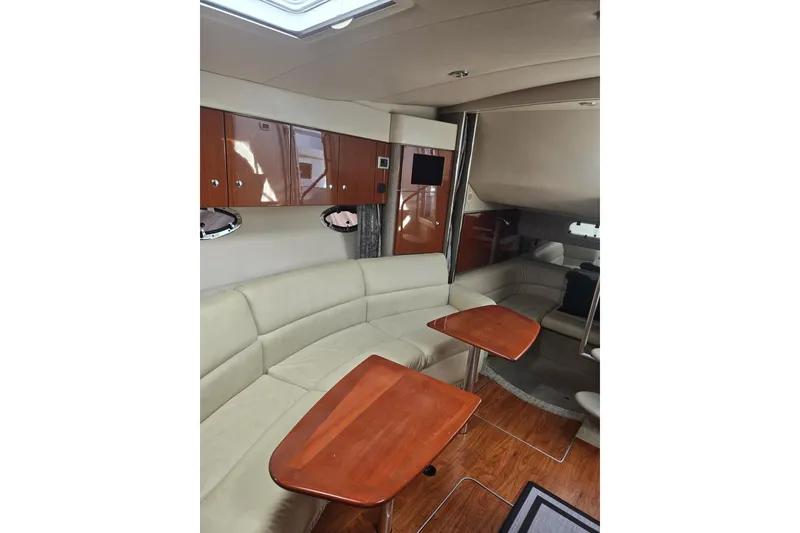 Slide: The Image of Interior of 2007 Formula 34 Performance Cruiser with elegant seating and wooden tables. - 11