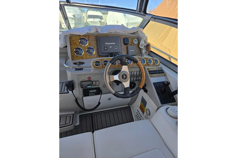 Slide: The Image of Helm of 2007 Formula 34 Performance Cruiser with Raymarine navigation system and wood-accented steering wheel. - 2