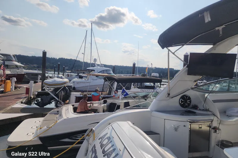 Slide: The Image of Boats docked at marina, featuring a 2007 Formula 34 Performance Cruiser under a sunny sky. - 21