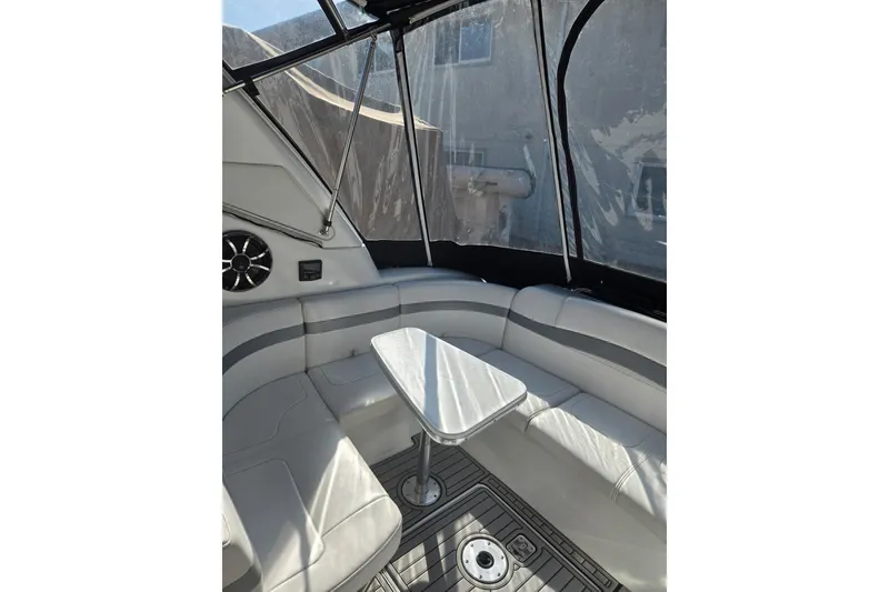 Slide: The Image of Interior of 2007 Formula 34 Performance Cruiser with white seating and small table. - 7