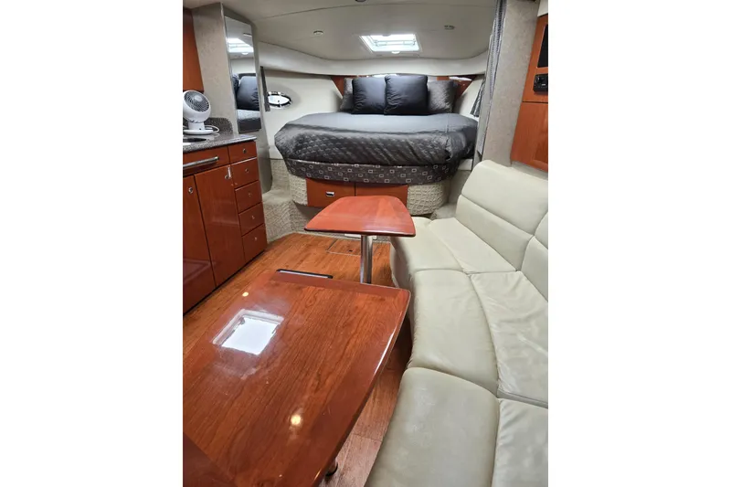 Slide: The Image of Interior of 2007 Formula 34 Performance Cruiser with bed, seating, and wooden cabinetry. - 8